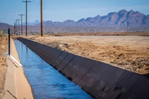 Irrigation Infrastructure Enhancement with Ocean Geotextile - Serene canal in Yuma, Arizona, with desert mountains in the bac
