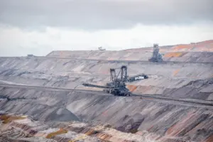 Case Study: Slope Protection and Sustainable - Aerial view of bucket-wheel excavators in an expansive open-pit coal mine.