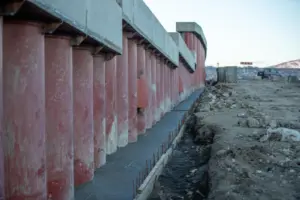 Stabilising a Strategic Airbase: How Ocean - View of a construction site featuring large concrete columns, earthwork, and mac